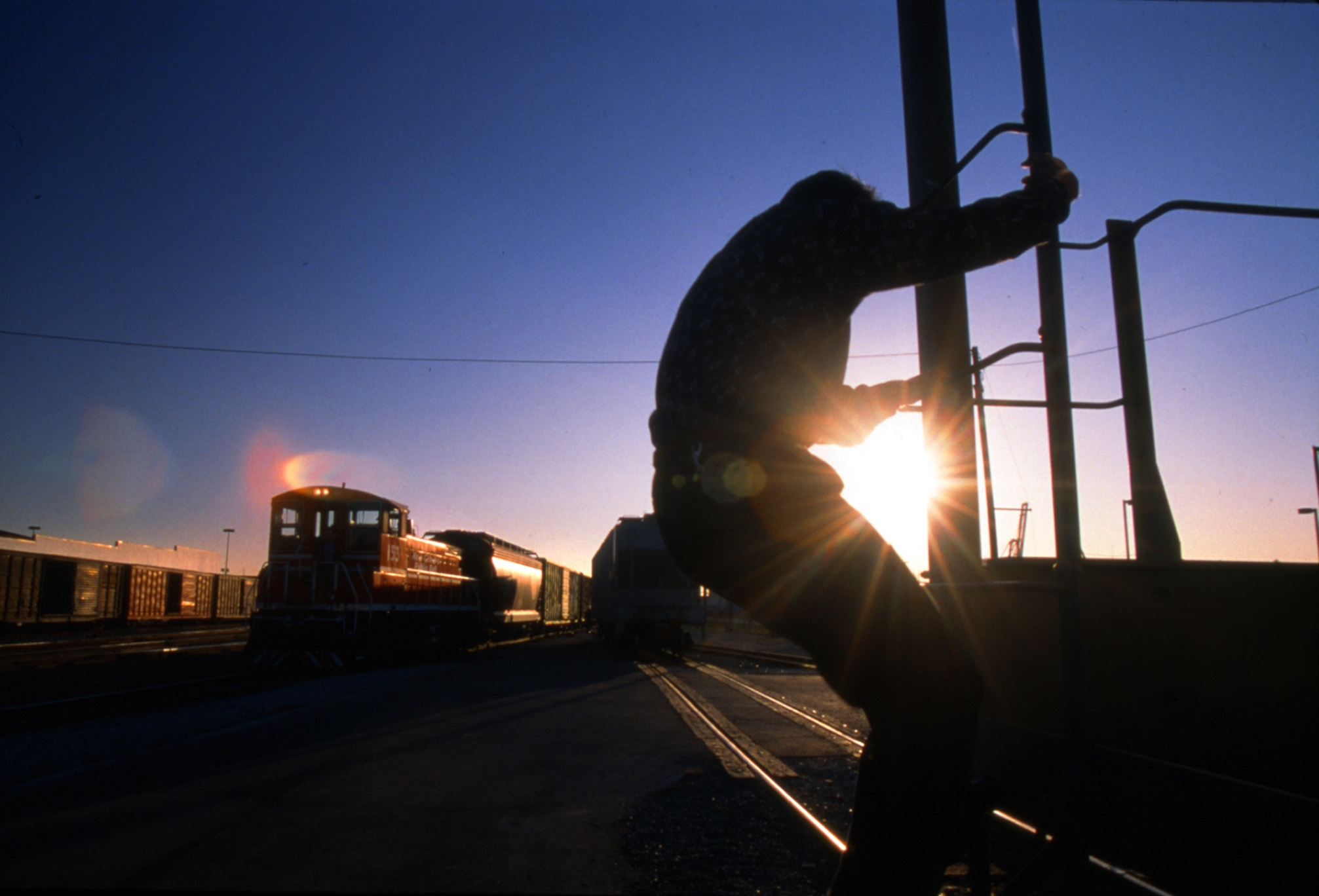 Railroad Worker at Sunset