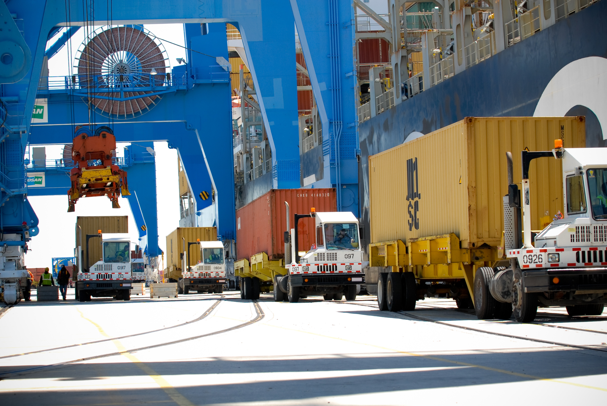 Gantry Cranes Loading Containers Onto Drayage Trucks